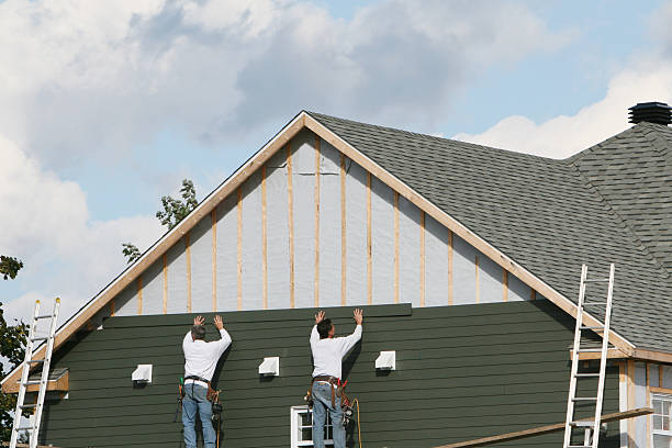 Professional Storm Damage Siding Repair technician working in Hilliard, FL